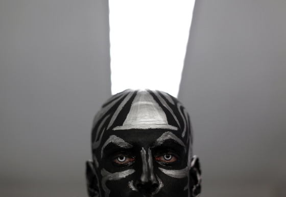 Image: Ruben Hidalgo, 25, a contestant poses before taking part in a body paint pageant during Expobelleza Andalucia (Expobeauty Andalusia) in the Andalusian capital of Seville