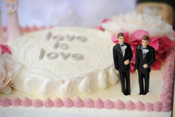 A wedding cake with a male couple