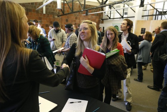 Job seekers attend a marijuana industry job fair hosted by Open Vape, a vaporizer company, in Downtown Denver.