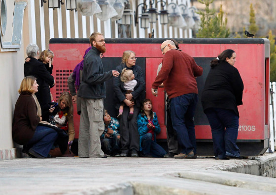Image: Foreigners evecauated by police from the site of an attack in Kabul are seen