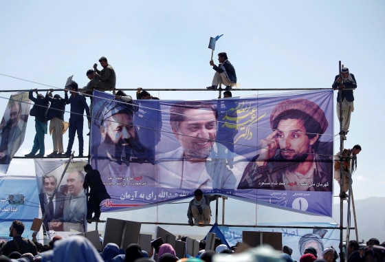 Image: Supporters of Afghan presidential candidate Abdullah attend an election rally in Mazar-I-Shariff