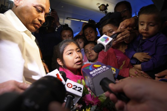 Image: Mario Vargas-Lopez and his daughter talk to reporters after they were reunited at Los Angeles International Airport