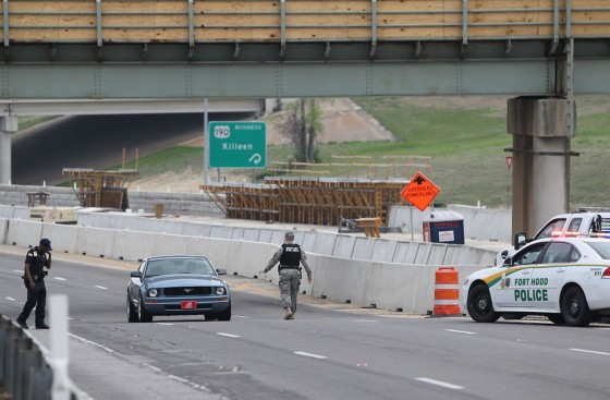 Image: A military police officer stops a car in Fort Hood, Texas