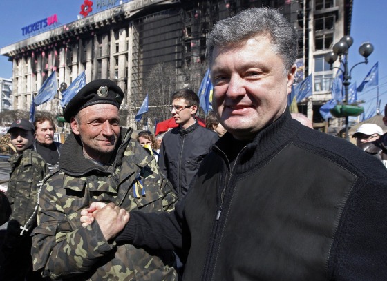 Image: Presidential candidate Petro Poroshenko shakes hands with a Maidan activist in Kiev
