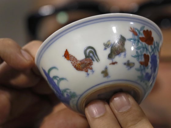 The Meiyintang “Chicken Cup” from the Chinese Ming Dynasty (1368-1644) is displayed in Hong Kong, on Tuesday. Sotheby’s said Shanghai collector Liu Yiqian won the bidding for the cup, which with the auction house’s commission, comes to $36.1 million, a world record for Chinese porcelain.