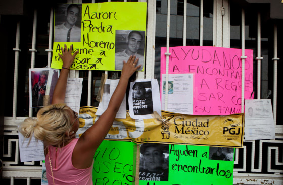 Image: Photos of recently disappeared relatives are posted in Mexico City on May 30, 2013.