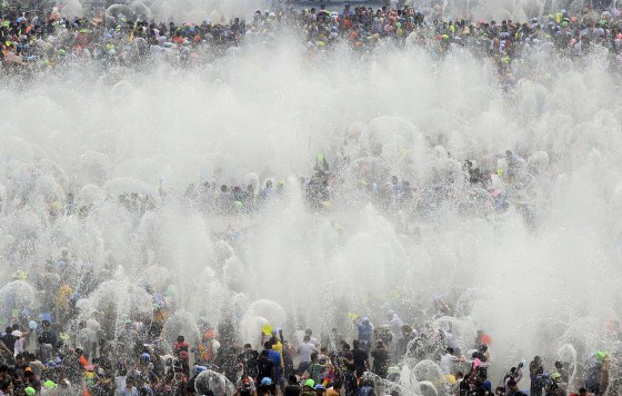 Image: Visitors participate in the annual water-splashing festival to mark the New Year of the Dai minority in Xishuangbanna