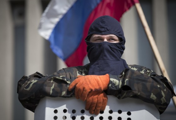 Image: Masked pro-Russian protester in Luhansk, Ukraine