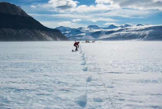 Image: Field glaciologist Daniel Baggenstos collects samples on Taylor Glacier in Antarctica