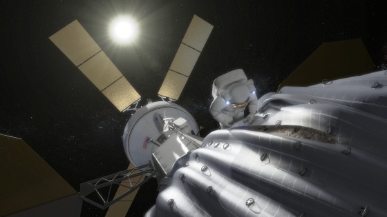 An artist's conception shows an astronaut preparing to take samples from a captured asteroid after it has been relocated to a stable orbit in the Earth-moon system. Hundreds of rings are affixed to the asteroid capture bag, helping the astronaut carefully navigate the surface.