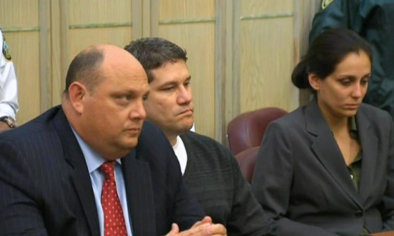 Image: Michel Escoto, center, of South Florida, was found guilty of first-degree murder in the killing of wife Wendy Trapaga in October 2002 to collect a $1 million insurance policy