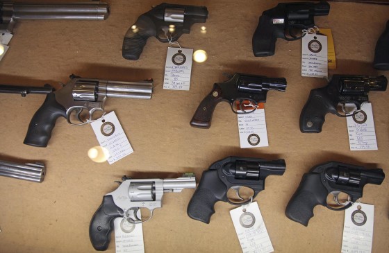 Image: Handguns are displayed in the sales area of a gun range