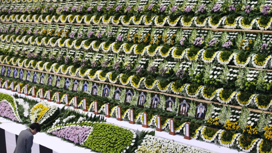 A mourner pays tribute to the victims of the sunken ferry Sewol, at a gymnasium in Ansan, South Korea, on April 23, 2014.