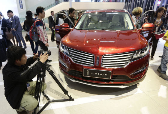 Visitors look at a Lincoln MKX car at Auto China 2014 in Beijing