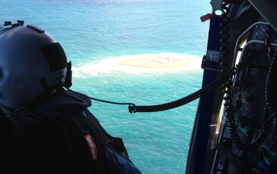 Five marooned snorkelers were rescued after the huge \"SOS\" message they scrawled in a sandbar was spotted by a helicopter. The group was winched to safety after their boat broke its anchor and drifted while they were exploring a rocky outcrop off Australi