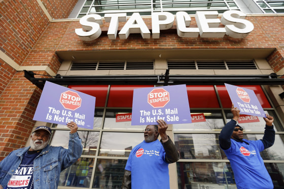 USPS workers picket outside Staples store