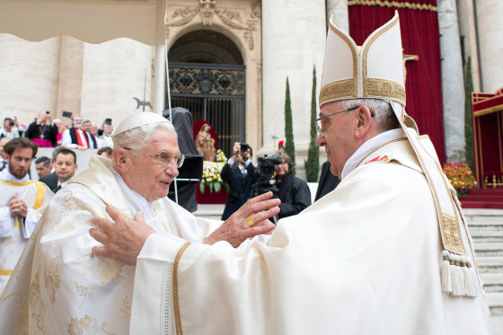 Image: Pope Francis embraces Pope Emeritus Benedict XVI during Mass before the canonisation ceremony of Popes John XXIII and John Paul II at St Peter's Square at the Vatican