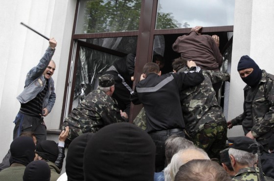 Image: Pro-Russian activists storm the regional government headquarters in Luhansk