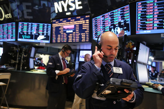 Image: Traders work on the floor of the New York Stock Exchange