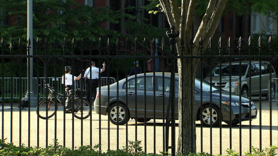 Image: A suspicious vehicle trailed a motorcade carrying Malia and Sasha Obama onto the White House grounds