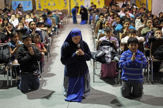 Sister Maria Parousia leads students during a religious studies class at Saint Gabriel of the Sorrowful Mother church in Avondale, Pa.