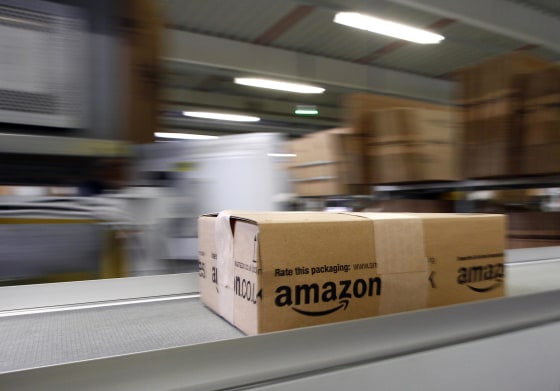 Image: A parcel moves on the conveyor belt at Amazon's logistics center