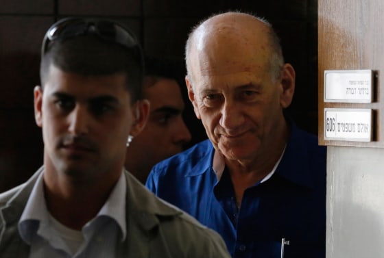 Image: Former Israeli Prime Minister Ehud Olmert leaves Tel Aviv District Court