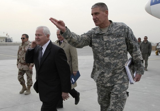 Image: U.S. Secretary of Defense Robert Gates is guided by U.S. Army Lt. General David Rodriguez after landing at Kabul International Airport