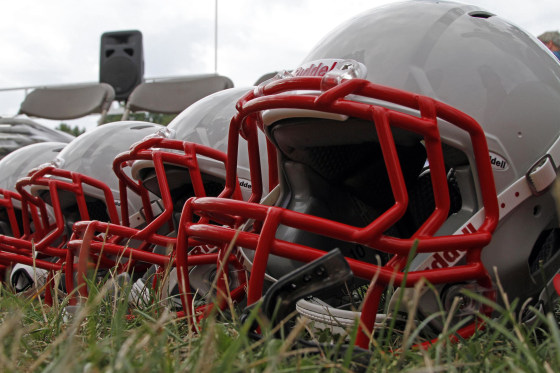 New football helmets were given to a group of youth football players from the Akron Parents Pee Wee Football League in Akron, Ohio, Aug. 4, 2012.