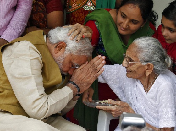 Image: Hindu nationalist Narendra Modi, the prime ministerial candidate for India's main opposition Bharatiya Janata Party (BJP), seeks blessings from his mother Heeraben