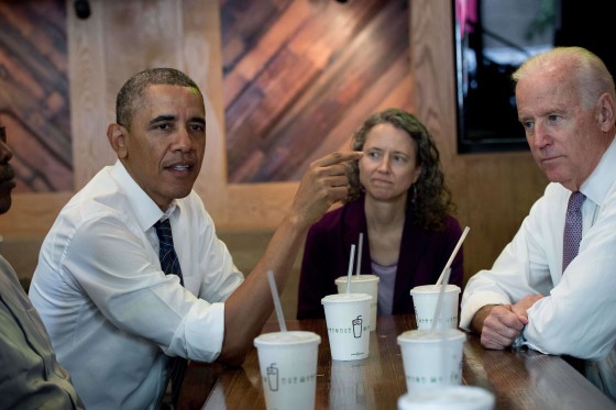 US President Barack Obama speaks with reporters as he has lunch with Vice President Joe Biden (R) and four workers from a neighborhood development project at a Shake Shack hamburger restaurant in Washington on May 16, 2014 to highlight his plan to increase investment in infrastructure. AFP PHOTO/Nicholas KAMMNICHOLAS KAMM/AFP/Getty Images