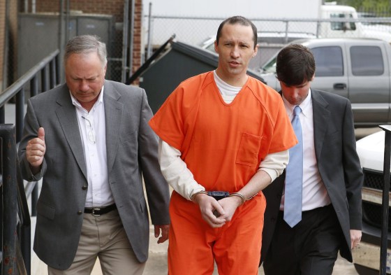 Image: James Everett Dutschke flanked by U.S. Marshals arrives for a sentencing hearing at the United State Federal Building in Aberdeen