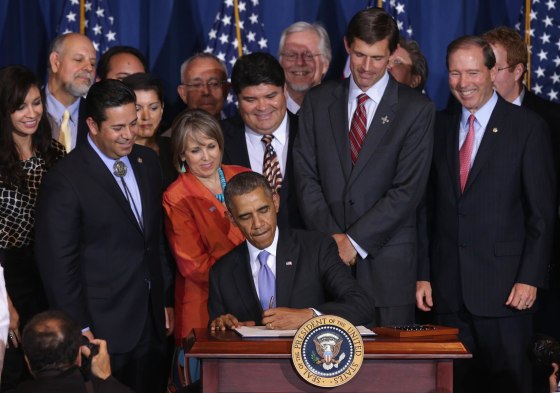 President Barack Obama signs a proclamation at the Interior Department May 21, 2014 in Washington, DC. The proclamation was to establish the Organ Mountain-Desert Peaks National Monument in south-central New Mexico.