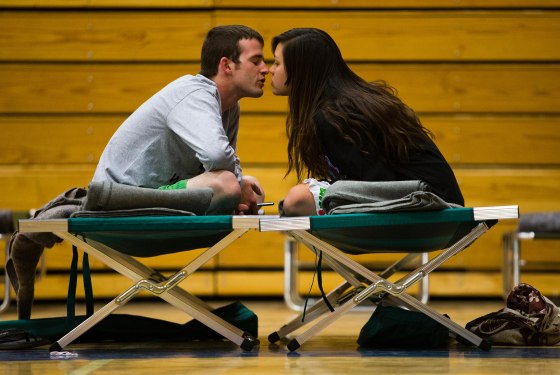 Nathan Westerfield, 22, kisses his new bride, Mickella, 20, at the Red Cross shelter set up at Sinagua Middle School in Flagstaff, Ariz.
