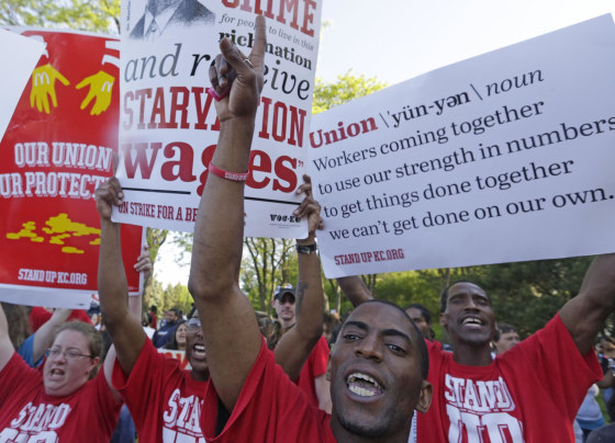 Hundreds of protesters gather outside of the McDonald's Corporation in Oak Brook, Ill., demonstrating for a $15 an hour wage and the right to unionize.
