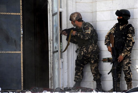 Image: Afghan military personnel take position at the scene of an attack on the Indian consulate in Herat