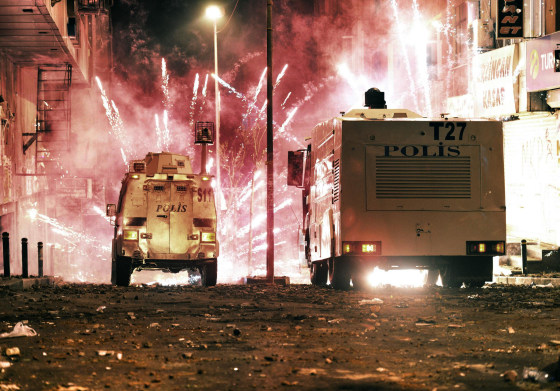 Image: Riot police use water cannons and teargas to disperse people who were protesting the Soma mine disaster