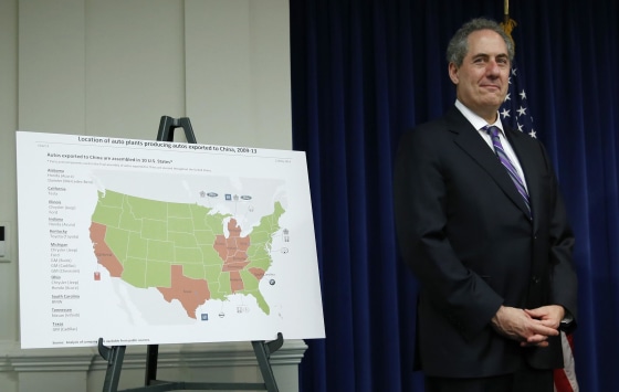 U.S. Trade Representative Michael Froman stands beside a map showing U.S. auto plants that export to China. The WTO ruled in favor of Washington in a trade dispute over Chinese duties on imports.