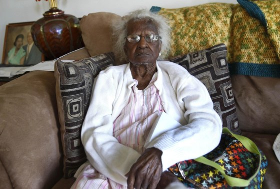 Image: Talley sits on her couch for a photograph during her 115th birthday in her home in Inkster