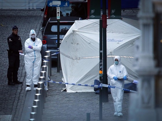Image: Police officers and crime scene investigators work at the scene of a shooting near the Jewish Museum in Brussels