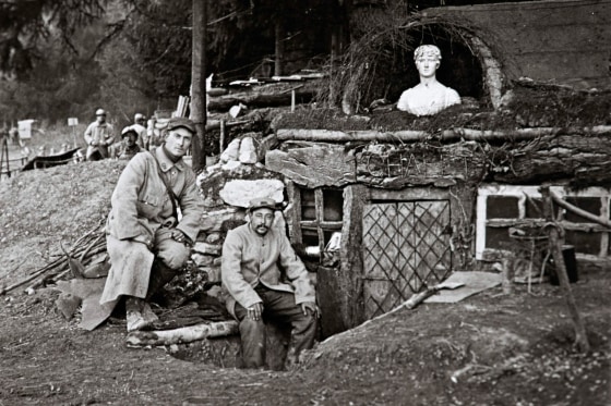 Image: French soldiers posing outside their shack, called \"The Chalet,\" at la Sapiniere near Lachalade on the Argonne front, eastern France in World War I