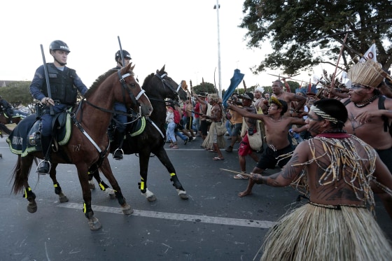 Image: Police confront native Brazilians during a demonstration in Brasilia