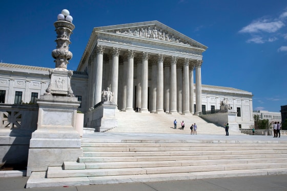 Image: People walk on the steps of the U.S. Supreme Court in Washington