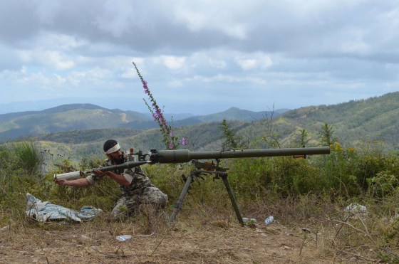 A rebel fighter loads an anti-tank cannon during fighting against pro-government forces on June 1, 2014 on the outskirts of Syria's Mediterranean port city of Latakia.