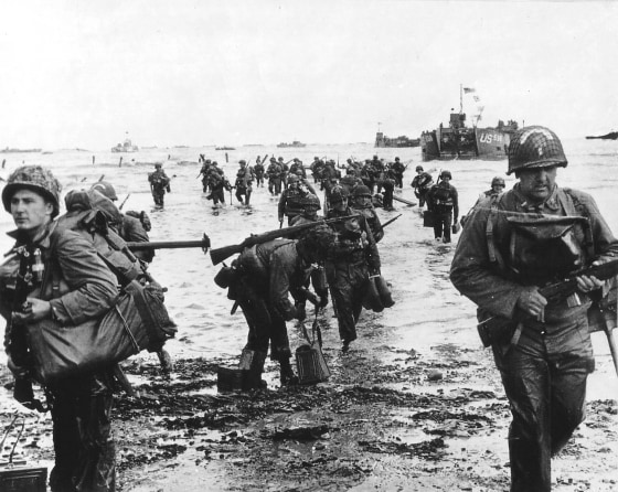 Image: Handout photo of U.S. reinforcements landing on Omaha beach during the Normandy D-Day landings near Vierville sur Mer