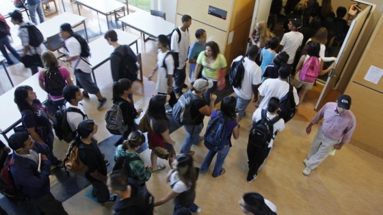 Students rush in to a lecture hall to get a seat for a chemistry class at the California State University East Bay in Hayward, Calif., Wednesday, Sept. 23, 2009. More than 50 students were on a waiting list for the class. It isn't just tuition hikes driving up the cost of college. In cash-strapped California and around the country, deep budget cuts are trapping more college students in a kind of enrollment purgatory, where they're in school but can't get seats in the courses they need to move toward a degree. The likely result: more time in college. (AP Photo/Eric Risberg)