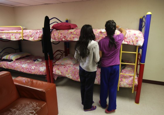Girls stand in a dorm at the shelter for underage immigrants and repatriated minors "Mexico, my home" in Ciudad Juarez May 27, 2014.
