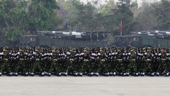 Image: Soldiers march during a parade to mark the 69th Armed Forces Day in Myanmar's capital Naypyitaw