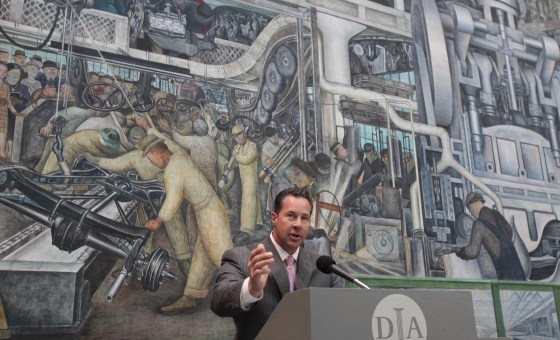 Chrysler Group U.S. Sales head Reid Bigland stands in front of The Detroit Industry fresco by Mexican muralist Diego Rivera during a news conference to announce foundation pledges to the Detroit Institute of Arts on June 9, 2014.