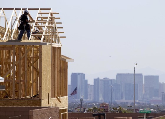 Image: Carpenters work on new homes at a residential construction site in the west side of the Las Vegas Valley in Las Vegas
